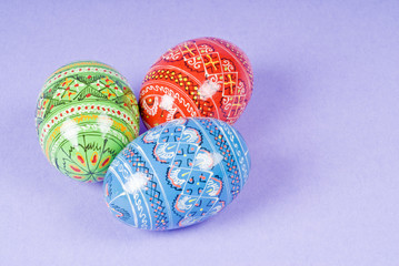 Colorful Easter Eggs on Purple Background