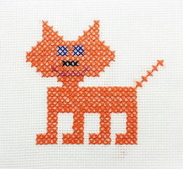 Manual embroidery a dagger of the image of a cat