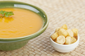 Carrots soup with parsley. Shallow depth of field
