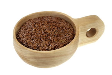 scoop of brown flax seeds