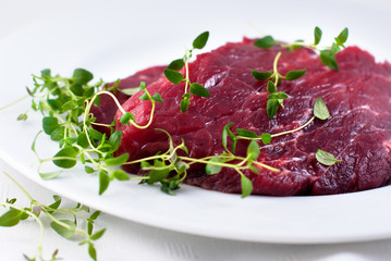 Raw beef with fresh thyme