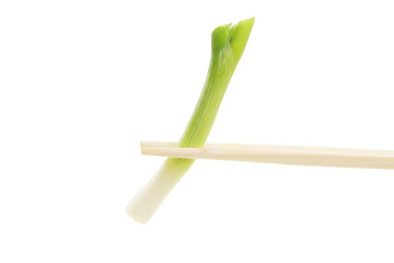 Spring onion in chopsticks