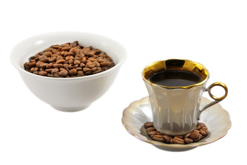 Cup of coffee and bowl with coffee beans