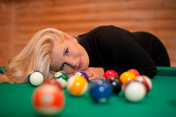 beautiful woman on a billiard table