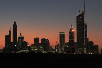 Fototapeta premium Sunset behind skyline of Dubai.