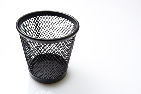 Empty mesh basket on white background
