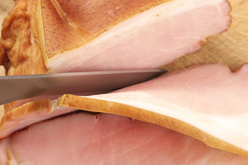 Sliced ham and knife