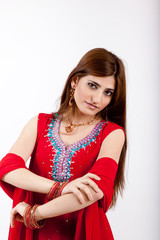Pretty Indian woman in red traditional dress