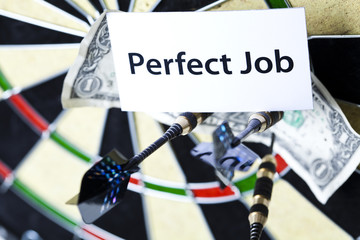Darts target and dollar in bull's-eye