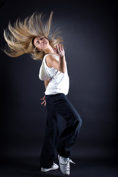 woman modern dancer against black background