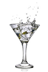 martini with olives and splash isolated on white