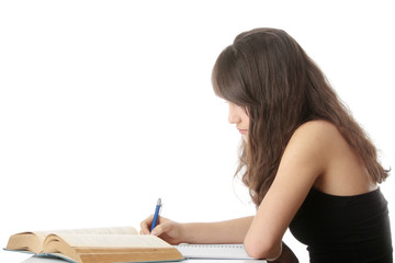 Teen girl learning at the desk