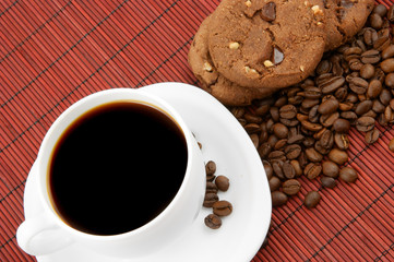 Coffee with chocolate cookies and grains