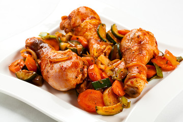 Roasted chicken drumsticks and vegetables