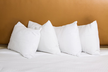 White pillows on bed in hotel room