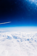 clouds on sky seen from  an airplane with wings
