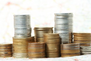 Coins lay on a map