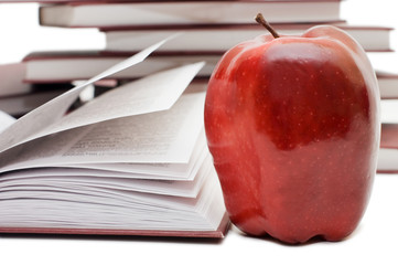 Stack of books and apple isolated