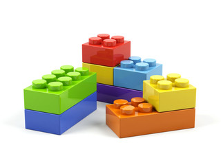 Plastic toy blocks on white background.