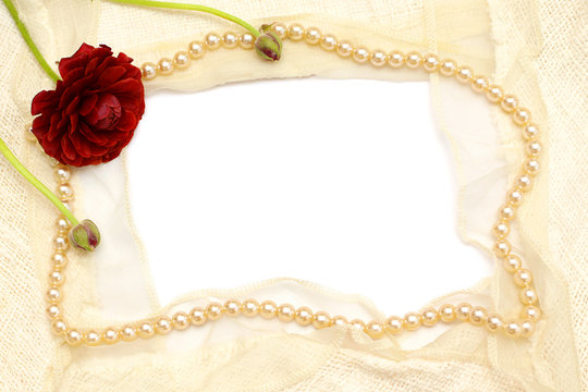 frame from flowers, pearls and white lace