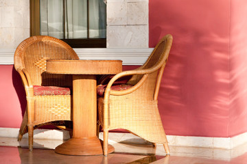 Brown wooden chairs an tables on patio