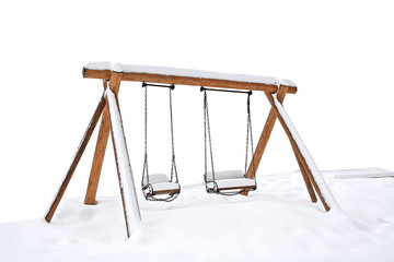 Swings covered with snow