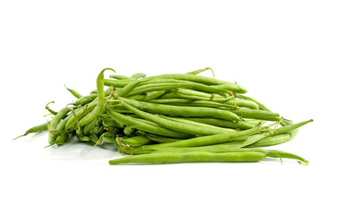 Pile of raw green beans over white background