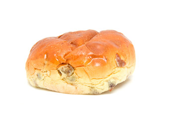 One raising bread: krentenbol over white background