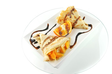 two pancakes on porcelan dish