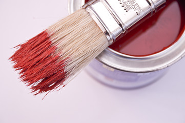 Red paint and brush