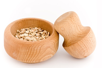 Mortar and Pestle whit oats flakes