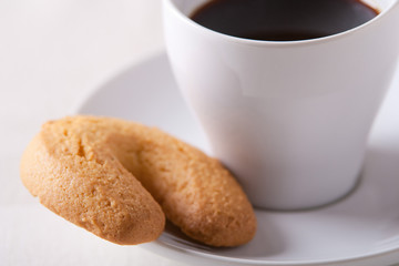Espresso coffee cup with a biscuit on the saucer