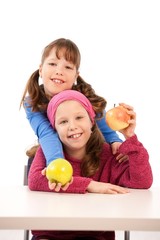 Fototapeta na wymiar Schoolgirls with apples