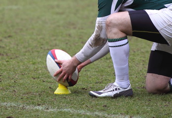 placing a rugby ball