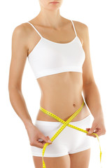 Woman measuring her slim body isolated on white