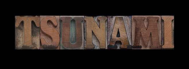 the word tsunami in old letterpress wood type