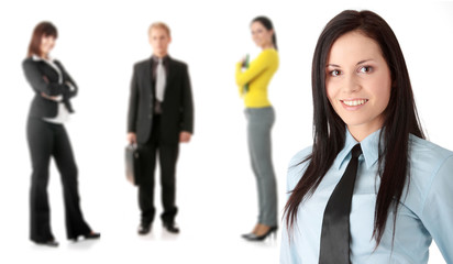 Businesswoman smiling with her teamwork behind