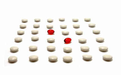 medication pills laying over white background