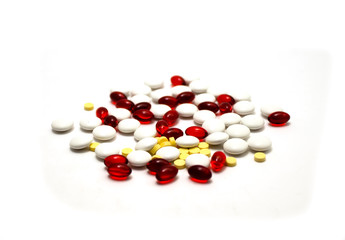 medication pills laying over white background