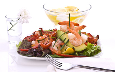 Prawn salad on mixed greens and sun dried tomatoes.