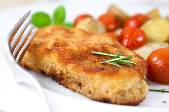 Schnitzel with baked vegetables and herbs