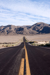 Long asphalt desert road