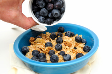Pouring Blueberries On Cereal