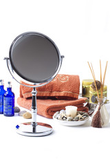 Spa tools, orange towels, stones for relaxation treatment