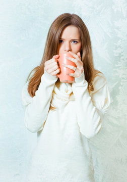 Girl with cup of hot tea