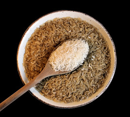 Brown and White Rice on Black Background
