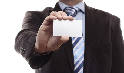 Businessman holding a business card. Isolated on white.