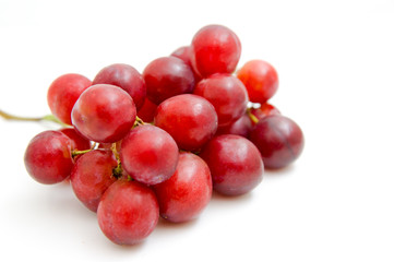 Red grapes on white