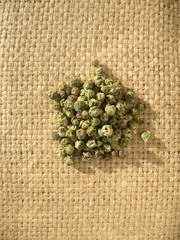spice-geen pepper on burlap background