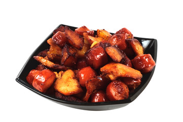 Dish with grilled sausages, meat and potatoes.
